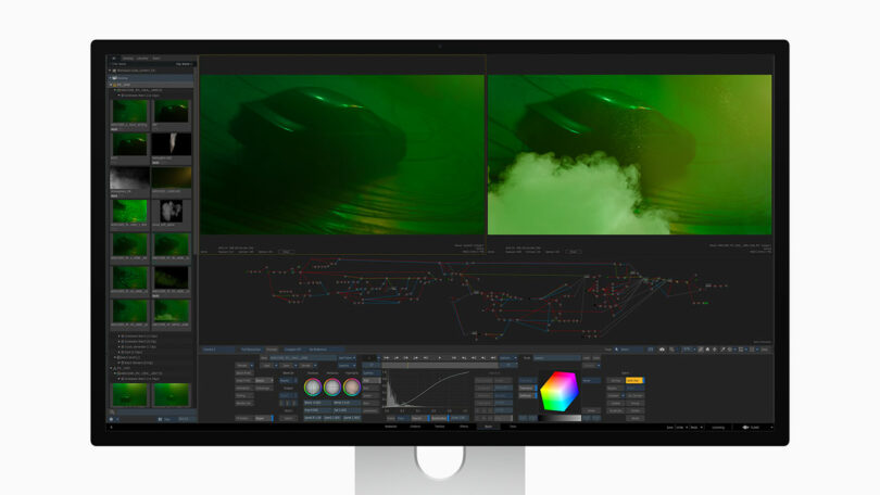 A computer monitor displays video editing software with two green-tinted video frames of a car and smoke, timeline, color controls, and node graph visible on the screen.