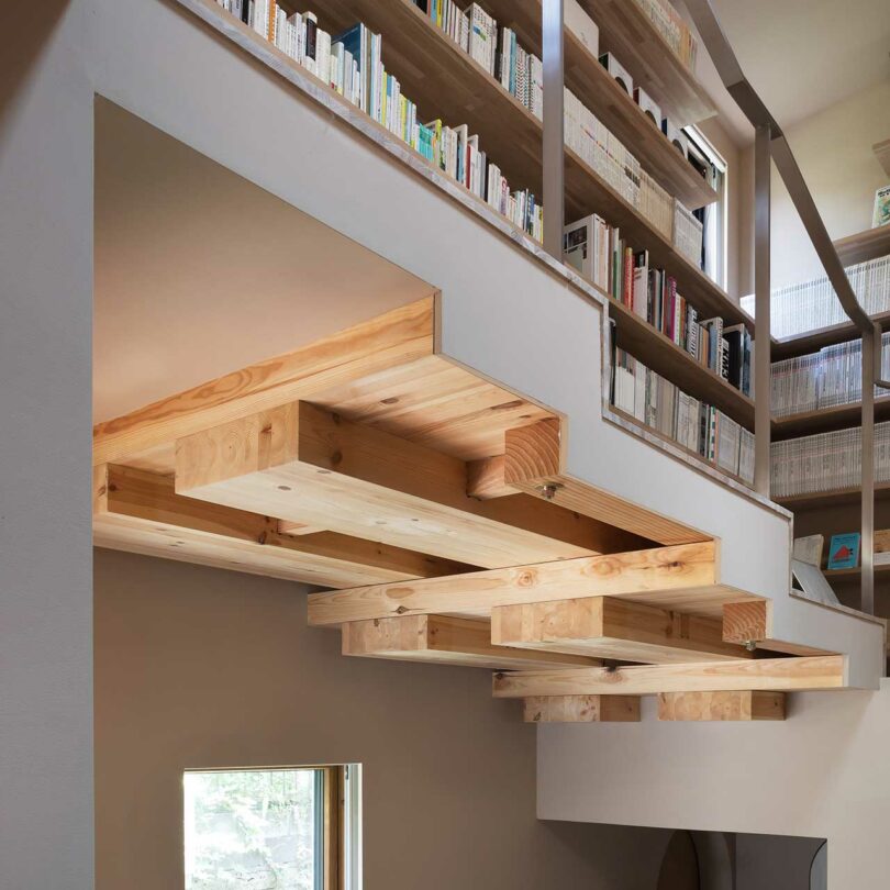 closeup view of staggered kitchen ceiling following the lines of the stairs above